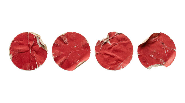 Set of four weathered red circular paper stickers isolated on transparent background