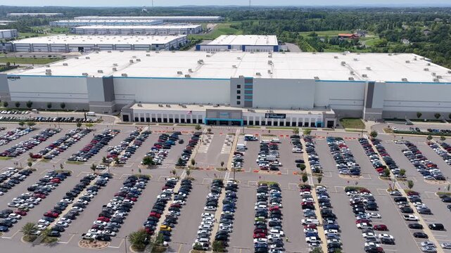 Aerial view of Amazon fulfillment center with a large parking lot filled with vehicles in Mt. Juliet, Tennessee, United States.