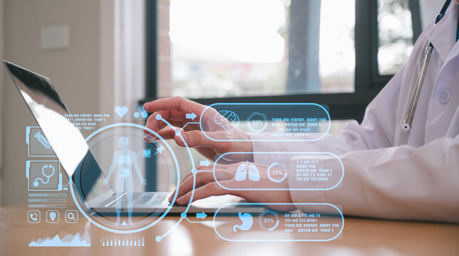 Male doctor wearing white cloth using stethoscope tablet and computer working diagram analysing patient diagnosis data with virtual heart icon in medicine and healthcare concept