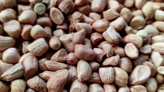 Macro texture background of fresh raw peeled peanuts. High quality close up view of organic groundnut seeds for healthy diet concept