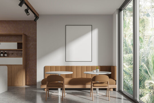 Contemporary cafe interior with empty poster mockup, modern architectural style, tropical window background, hospitality branding concept, 3D Rendering