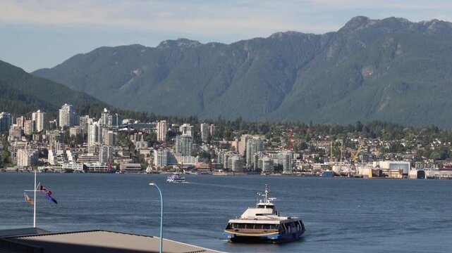 Ferry from North Vancouver arriving across the harbour, traffic in the bay
