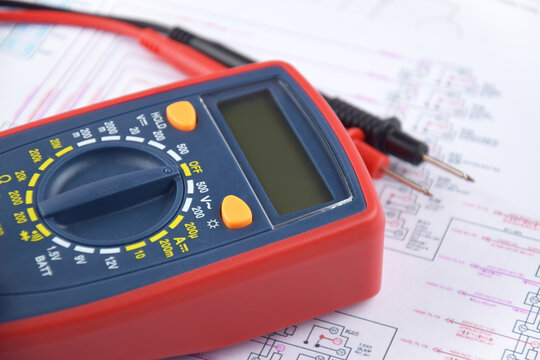 The digital multimeter electrical engineering drawings, circuit breaker and pencils