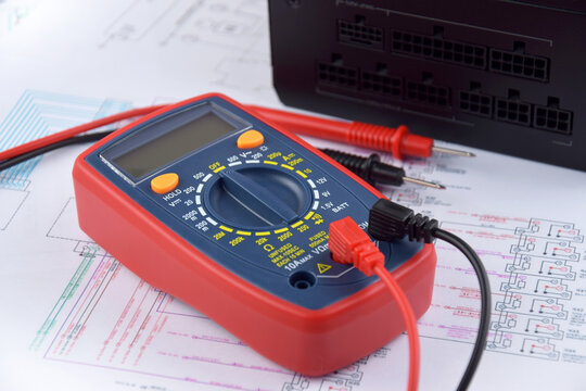 The digital multimeter electrical engineering drawings, circuit breaker and pencils
