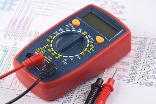 The digital multimeter electrical engineering drawings, circuit breaker and pencils