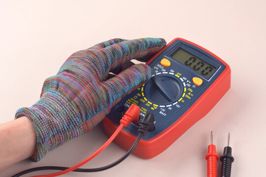 The digital multimeter electrical engineering drawings, circuit breaker and pencils.