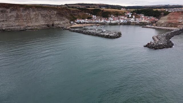 aerial view of Staithes seaside village and fishing port in the borough of Scarborough in North Yorkshire, England