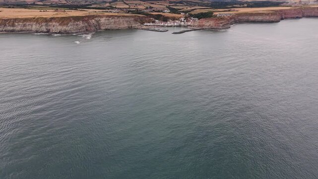 aerial view of Staithes seaside village and fishing port in the borough of Scarborough in North Yorkshire, England