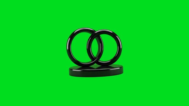 Two interconnected black rings resting on a smooth black base on green