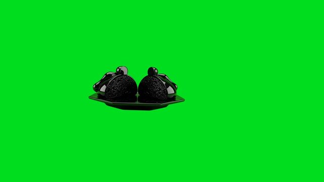 Two glossy black decorative objects resting on a matching hexagonal tray