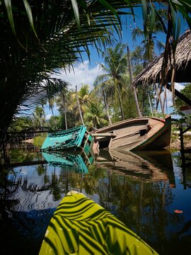 Sunken boat on a river near Kampot Cambodia, discovered while kayaking