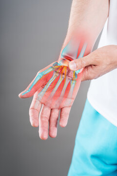 Pain in hand of man, with illustration anatomical joint, bones, nerve and red backlight. Trigger finger, or carpal tunnel syndrome medical concept
