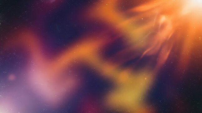 A close-up, abstract image of a swirling nebula in deep space, characterized by soft, ethereal glows of orange, yellow, and red against a deep purple and black background. 