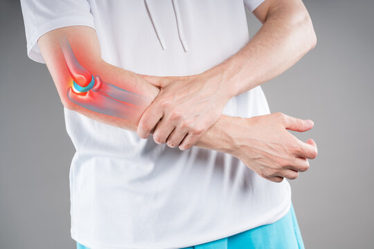 Diseases of the elbow joint, fractures displaced and inflammation of bones, close-up of person suffering from elbow pain