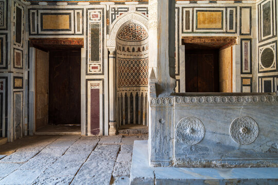 View of the intricate marble wall paneling and carved stone mihrab inside the Mausoleum of Ibrahim Agha Mustahfizan at the Aqsunqur Mosque, El-Darb El-Ahmar, Cairo Governorate, Egypt.