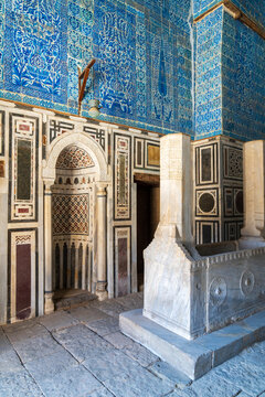 View of the marble cenotaph and blue Iznik tile walls inside the Mausoleum of Ibrahim Agha Mustahfizan at the historic Aqsunqur Mosque in El-Darb El-Ahmar, Cairo Governorate, Egypt.