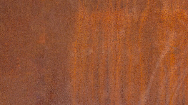 Grunge rusty orange brown metal corten steel stone background texture banner panorama..