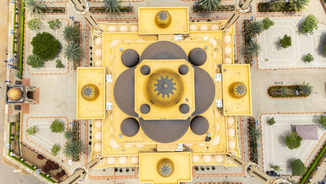 Aerial view of Ilorin Central Mosque featuring golden domes, minarets, and a symmetrical courtyard with palm trees in Oko Erin, Kwara, Nigeria.