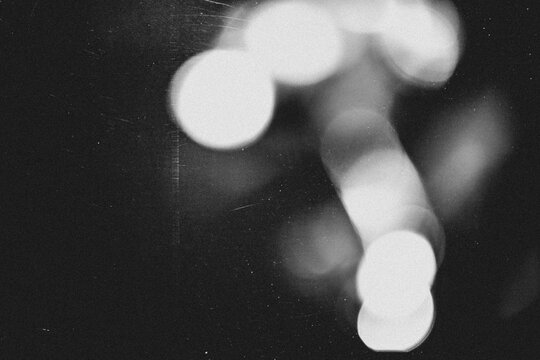 retro film overlay effect with scratch dust and light leaks,grain noisy film distressed texture light flare black background,old film background,grunge black and white abstract background with bokeh