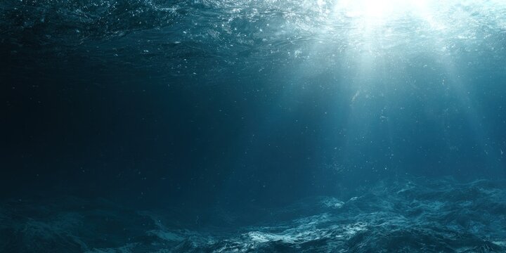 Underwater scene with sunlight streaming through the water surface creating an ethereal effect