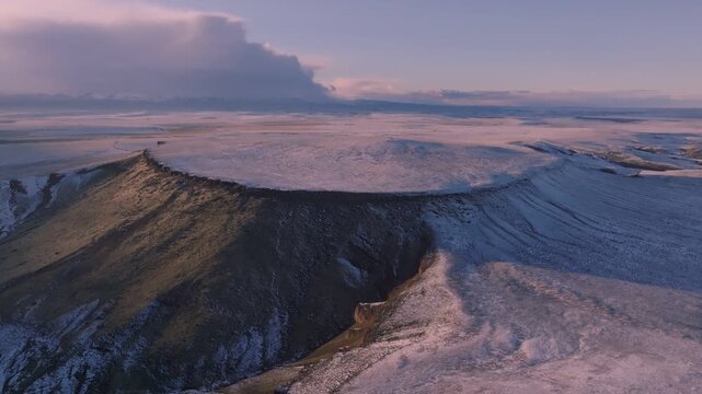 Aerial view of the snow-covered plateau at Morley Nelson Snake River Birds of Prey National Conservation Area during golden hour in Murphy, Idaho, United States.