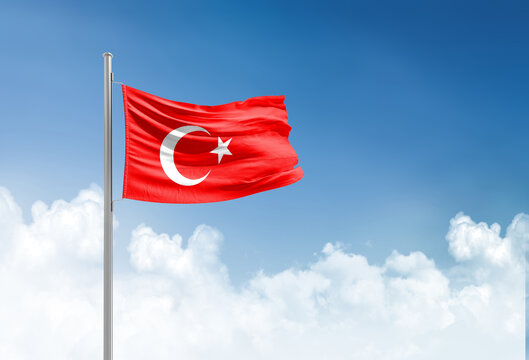 Turkey flag waving in beautiful sky.