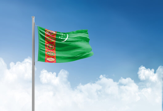 Turkmenistan flag waving in beautiful sky.
