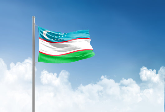 Uzbekistan flag waving in beautiful sky.