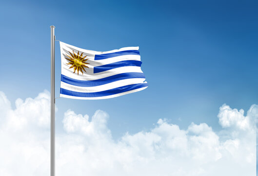 Uruguay flag waving in beautiful sky.