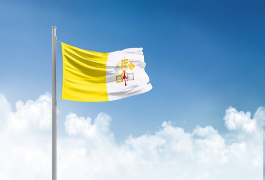 Vatican City flag waving in beautiful sky.