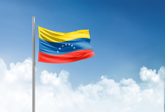 Venezuela flag waving in beautiful sky.