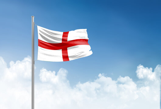 England flag waving in beautiful sky.