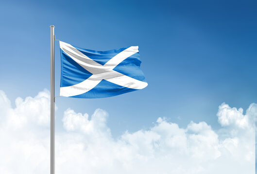 Scotland flag waving in beautiful sky.
