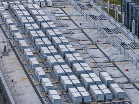 Aerial view of rows of industrial HVAC units and cooling equipment installed on a flat commercial rooftop in Drogheda, County Louth, Ireland.