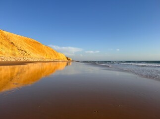 rocks and cliffs at the beach of Fuente del Gallo near Conil de la Frontera during low tide and sunset, Playa Fuente del Gallo, Cadiz, Andalusia, Costa de la Luz, Spain © keBu.Medien