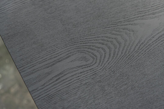 Close up of dark wood grain.
