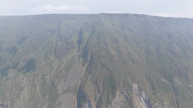 Aerial footage capturing the dramatic, rugged cliffs surrounding Garita da Herbeira near Meizoso, Spain.