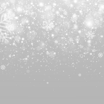 Winter snowfall with glowing snowflakes, sparkling particles and bright highlights.