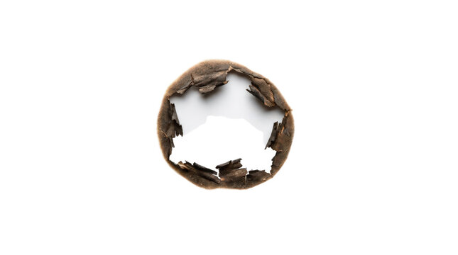 Burn hole in white paper isolated on transparent background