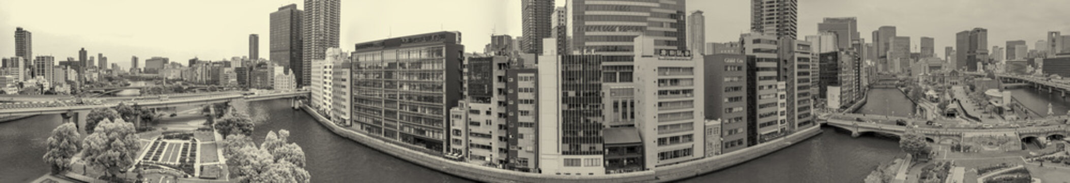 Osaka aerial panorama along river with skyline and urban cityscape view