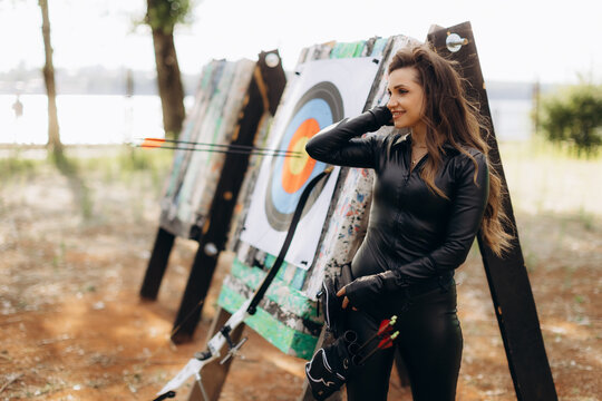 Woman enjoying archery sport with bow and arrow