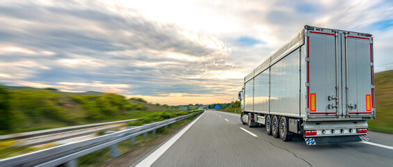Fototapeta premium Truck trailer on highway. Freight transport and delivery route.