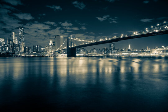 Toned photo of the Brooklyn Bridge and Lower Manhattan over the East River in New York City