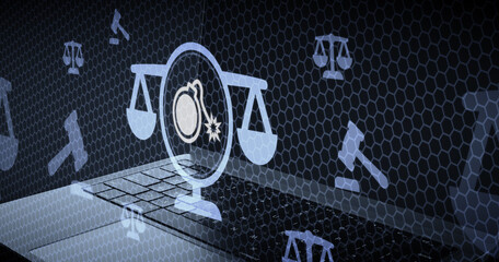 Digital law concept with scales of justice and a bomb icon symbolizing cybersecurity threats, legal regulations, and internet safety on a laptop computer © sh99