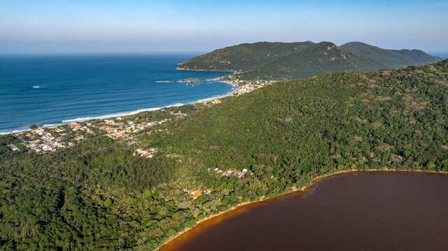 Florianopolis, Lagoa do Peri with Unusual Reddish Orange Water Discoloration in Santa Catarina Brazil, Aerial View