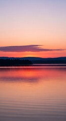 Obraz premium Beautiful soft pink light filling the sky during a calm and serene sunset