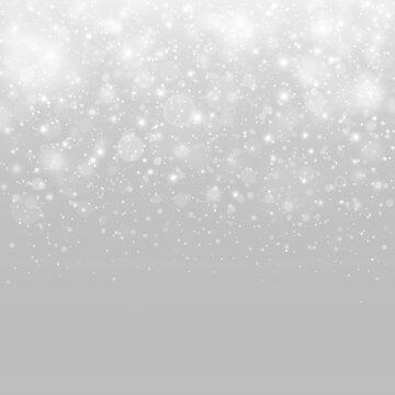 Snowfall with glowing particles, bright sparkles and winter atmosphere.