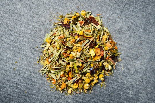 Dry Herbal healthy tea. On a gray concrete background.