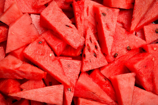 Texture of juicy watermelon cut into pieces. Top view. Macro photo of watermelon.