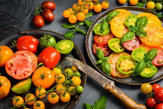 A plate with vegetarian tomato salad. Keto diet, healthy food. Fresh salad bowl. Top view.